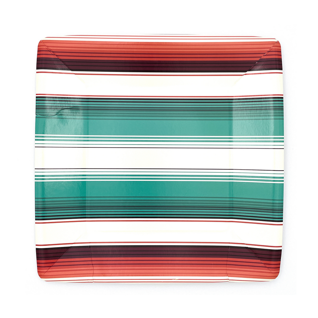 Square paper dinner plate with "Desert Stripe" turquoise, orange and creme colored stripes. Small black smudge due to a packing defect