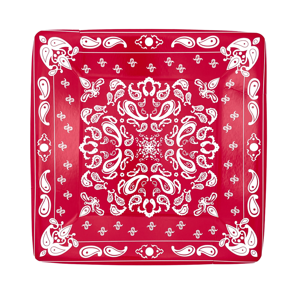Red colored square paper dinner plates with white bandana paisley print details.