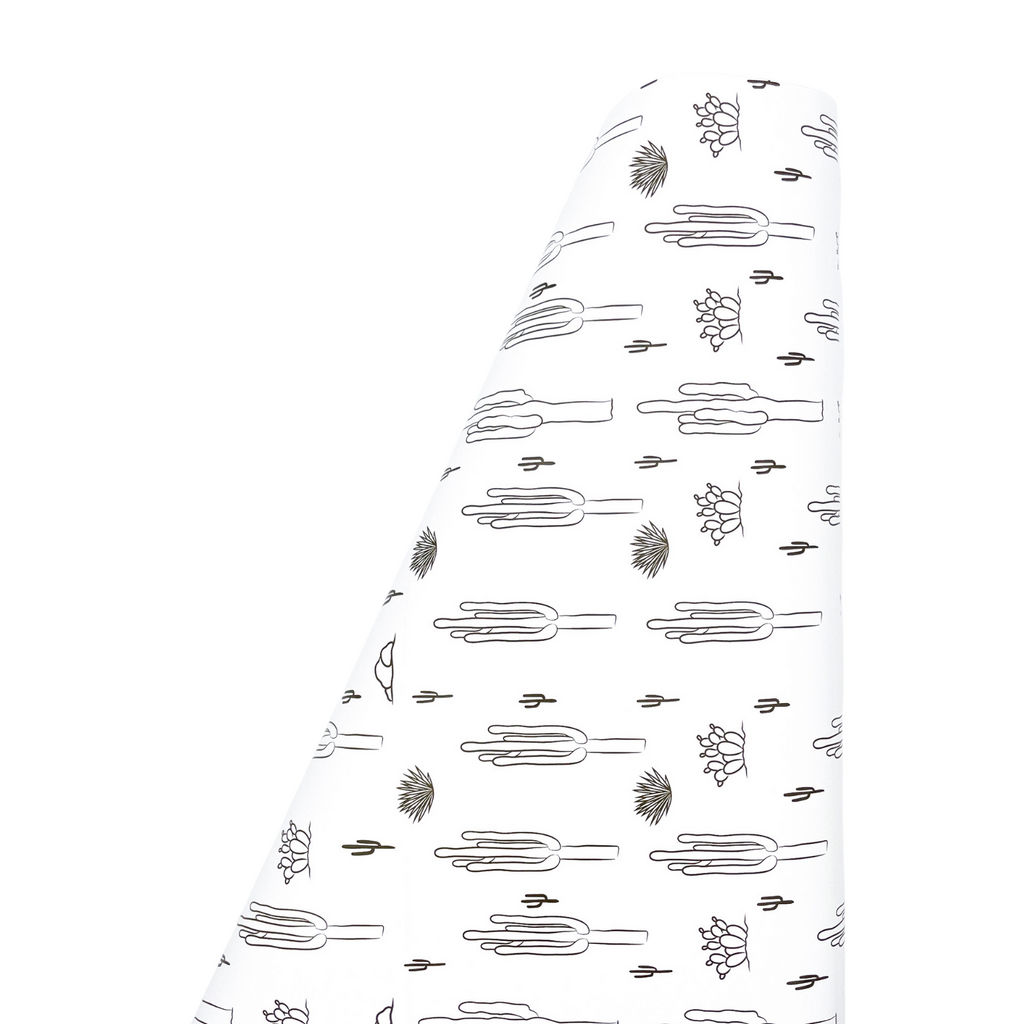 White background with black drawings of cactus in a pattern printed on heavyweight gift wrapping paper on a roll