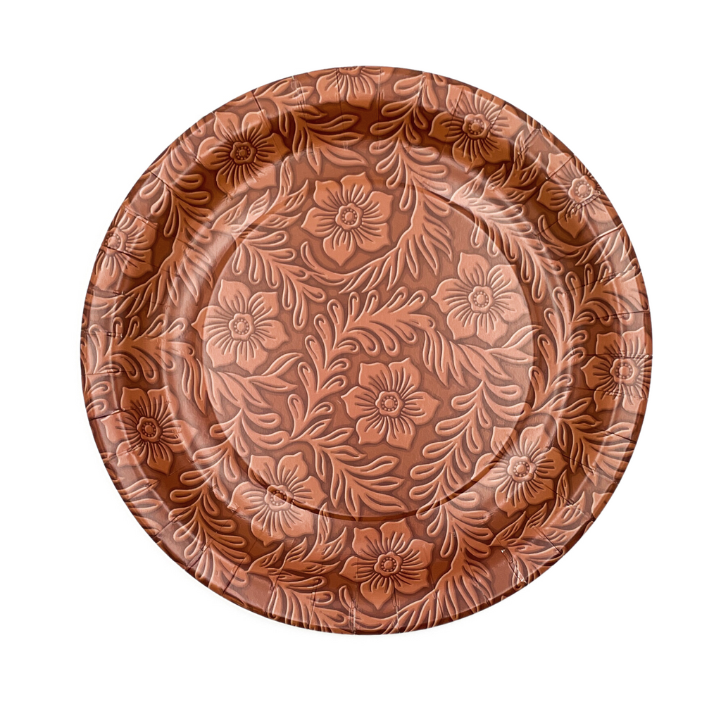 Light brown floral tooled leather print on a round, brown dinner plate