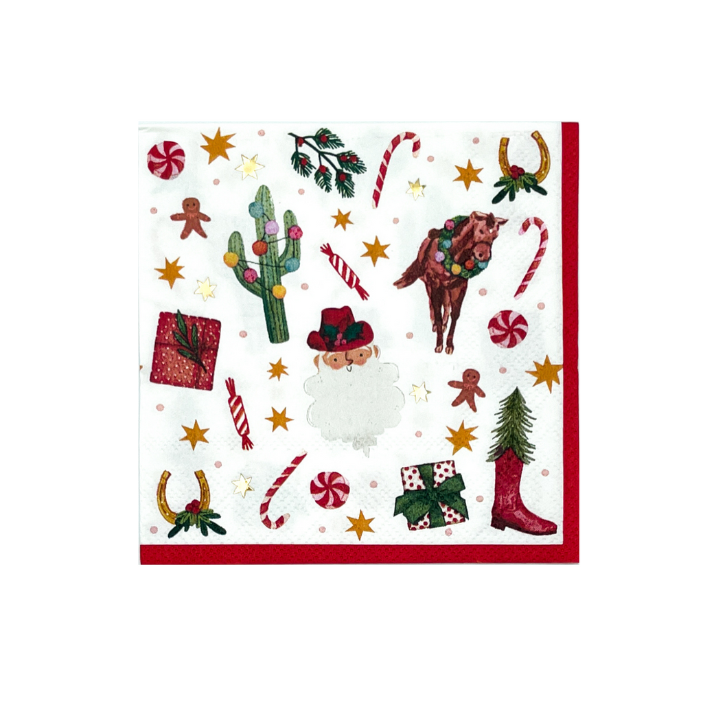 White cocktail napkin with a red border on two sides. Christmas pattern featuring the following hand-drawn motifs: Santa with a red cowboy hat, candy cane and mint candies, saguaro cacti with Christmas string lights, horses with wreaths around their necks, wrapped presents, holly branches,, horse shoes with holly, and orange and gold foil 6-point stars.