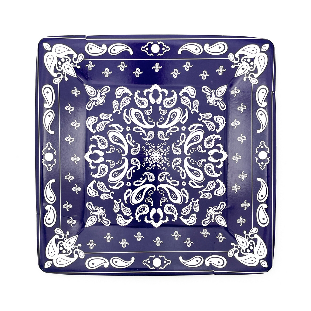 Navy blue colored square paper dinner plates with white bandana paisley print details.