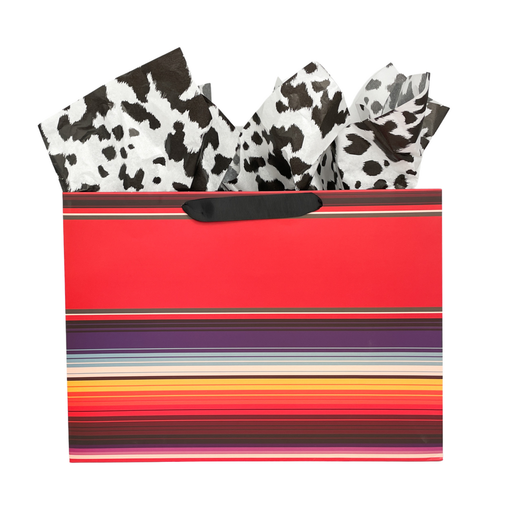 Large, Rectangle gift bag with red serape print. Colors are blue, red, yellow, white stripes. Black grosgrain ribbon handle