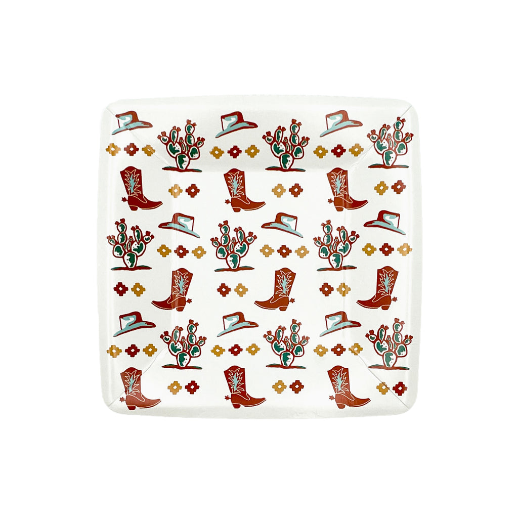 White square dessert plates with a gold and burnt orange concho, cowboy hat, cowboy boot, and cactus print.