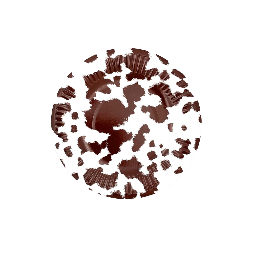 Brown and white cowhide print on white small paper dessert plate.