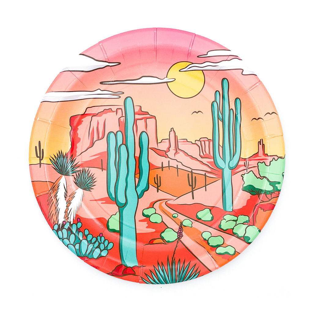 Pink, round  paper dinner plates with our "Party West" desert scene print. Green cactus and light pink mountain scene with white clouds and yellow sun.