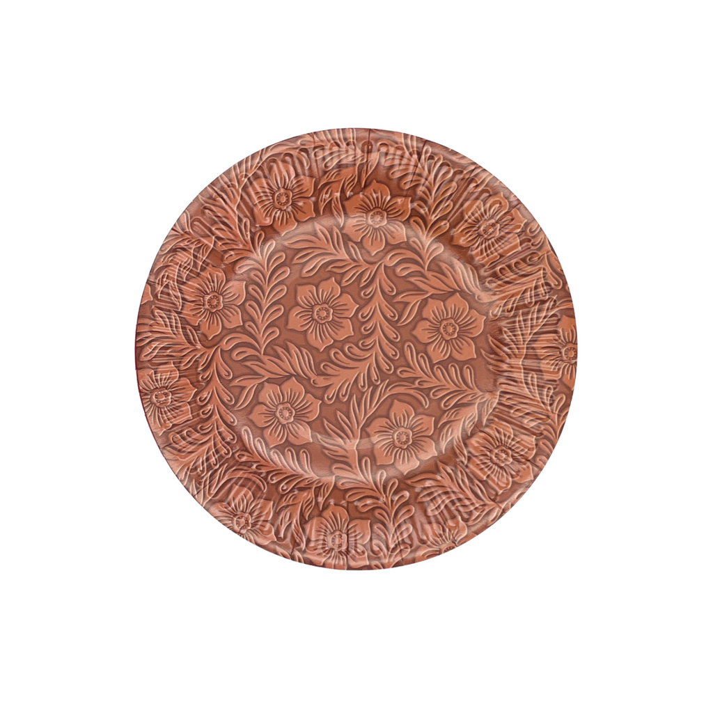 Light brown floral tooled leather print on a round, brown dessert plate