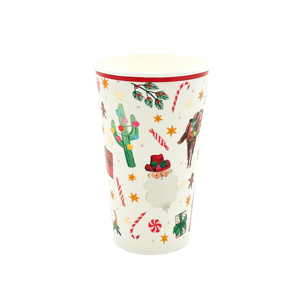 Paper cup with red border on top. Christmas pattern featuring the following hand-drawn motifs: Santa with a red cowboy hat, candy cane and mint candies, saguaro cacti with Christmas string lights, horses with wreaths around their necks, wrapped presents, holly branches,, horse shoes with holly, and orange and gold foil 6-point stars. 