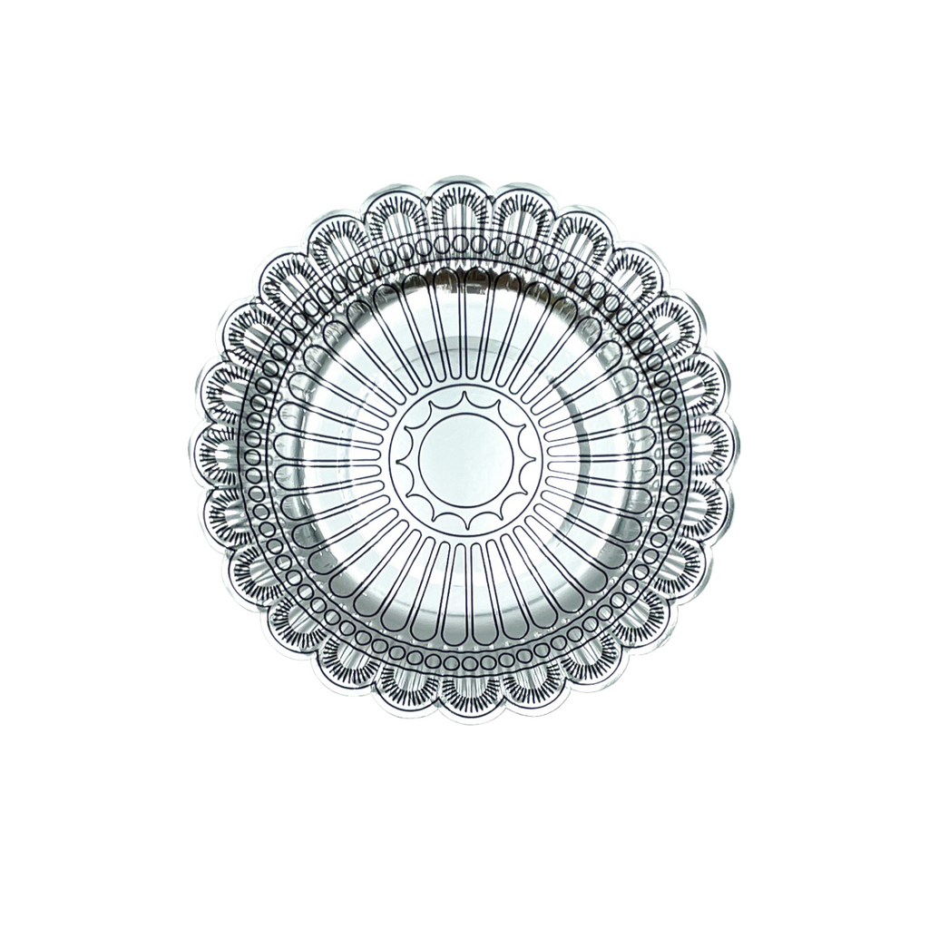 Round silver concho shaped dessert plate.