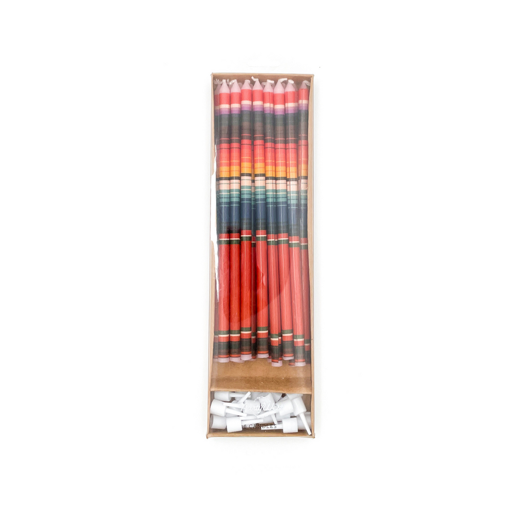 5.75in candles with red serape print. Colors are blue, red, yellow, white stripes. Cake picks are included