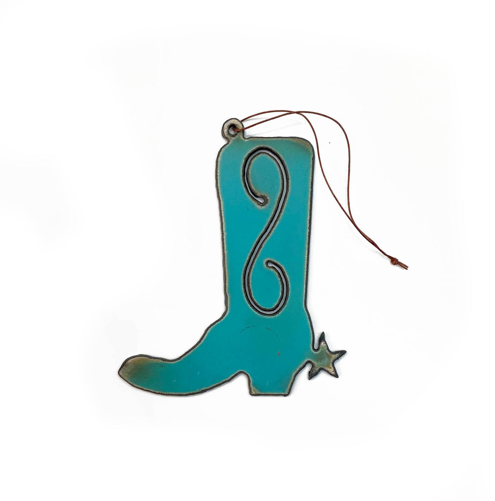 Turquoise cowboy boot shaped iron ornament with a star shaped spur. Brown string attached for hanging. 